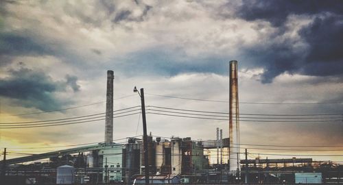 Low angle view of building against cloudy sky