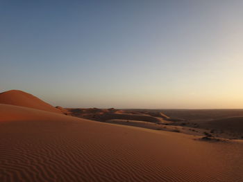 Scenic view of desert against clear sky