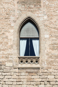 Low angle view of window of old building