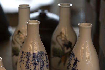 Close-up of wine glasses on table