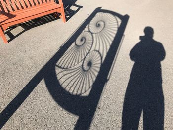 High angle view of people shadow on street