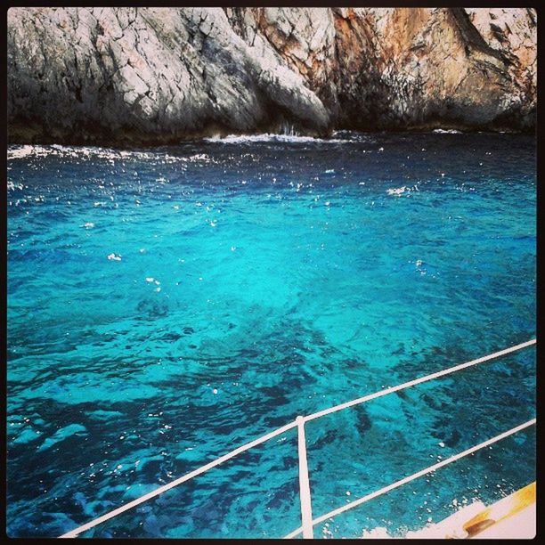 water, transfer print, sea, beauty in nature, scenics, auto post production filter, nature, high angle view, railing, tranquility, tranquil scene, rippled, rock - object, blue, day, idyllic, outdoors, river, turquoise colored, rock formation