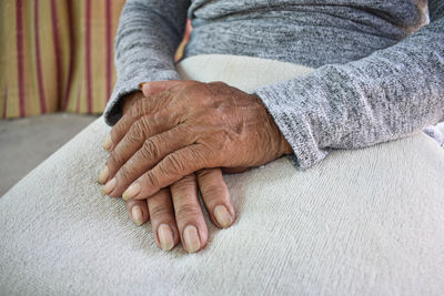 Midsection of woman with hands