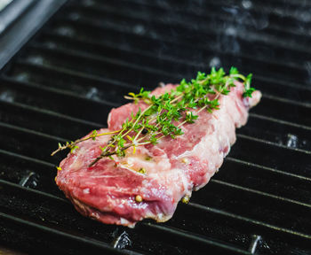 High angle view of meat on barbecue grill