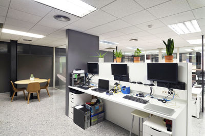 Empty chairs and tables in office