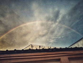 Low angle view of rainbow against sky