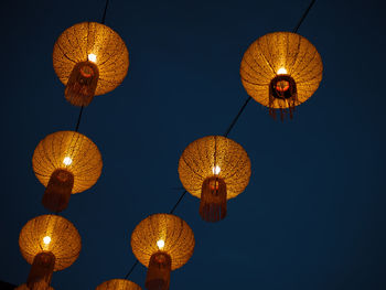 Low angle view of illuminated chandelier