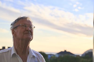 Senior man against sky during sunset