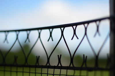 Close-up of chainlink fence against clear sky
