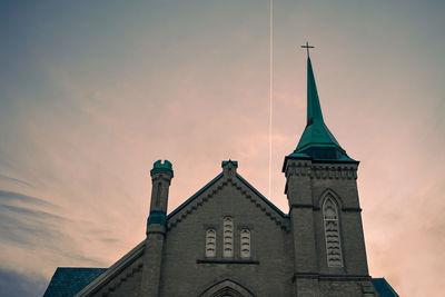 Low angle view of building against sky during sunset