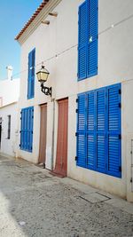 View of buildings against blue sky