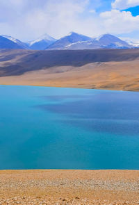 Scenic view of lake and mountains against sky at ladakh india. 