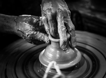 Man working on pottery wheel