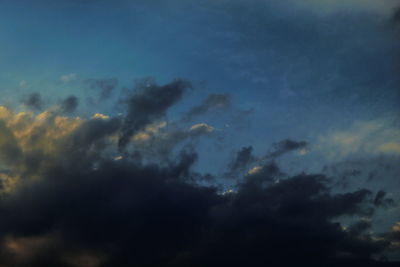 Low angle view of clouds in sky at sunset