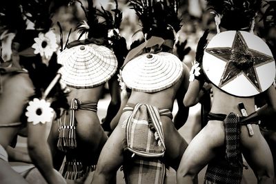 Rear view of people in hat