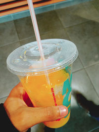 Close-up of hand holding drink