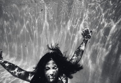 Portrait of woman swimming in sea