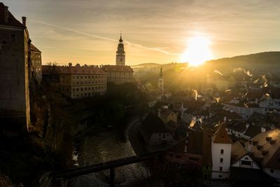 Silhouette of cesky krumlov castle and townscape during sunset
