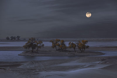 Scenic view of sea against sky at dusk