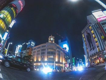 Low angle view of illuminated buildings at night