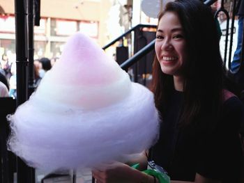 Portrait of smiling young woman in store