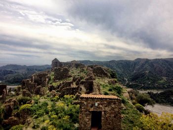 Castle on mountain against sky