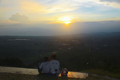 Rear view of a man at sunset