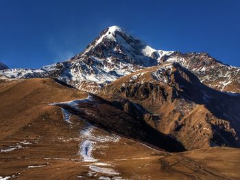 Scenic view of mount kazbek against sky