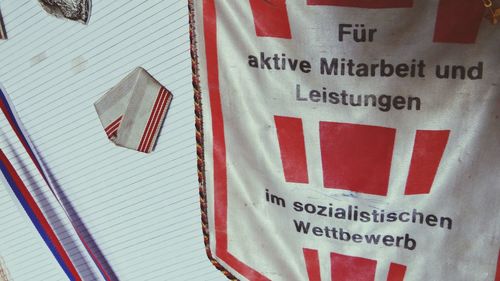 Close-up of flags against wall