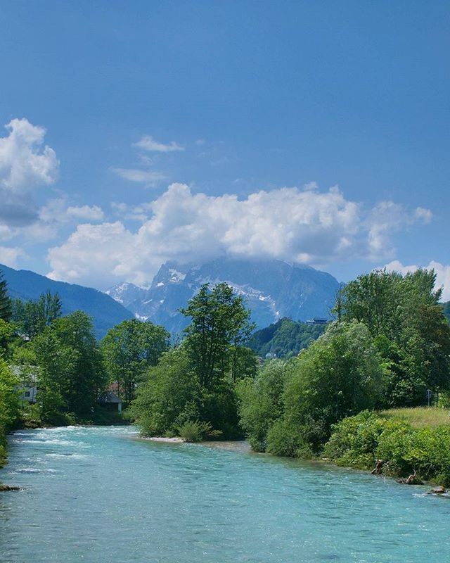 water, tree, sky, tranquil scene, scenics, tranquility, mountain, beauty in nature, waterfront, nature, lake, blue, cloud, cloud - sky, river, green color, idyllic, day, growth, non-urban scene