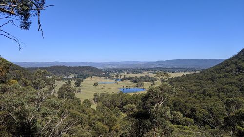 Scenic view of landscape against clear blue sky