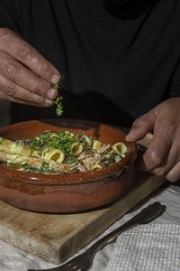 Midsection of man preparing food