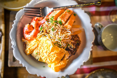 Bowl of delicious pad thai with shrimp and tofu.