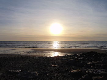 Scenic view of sea against sky at sunset