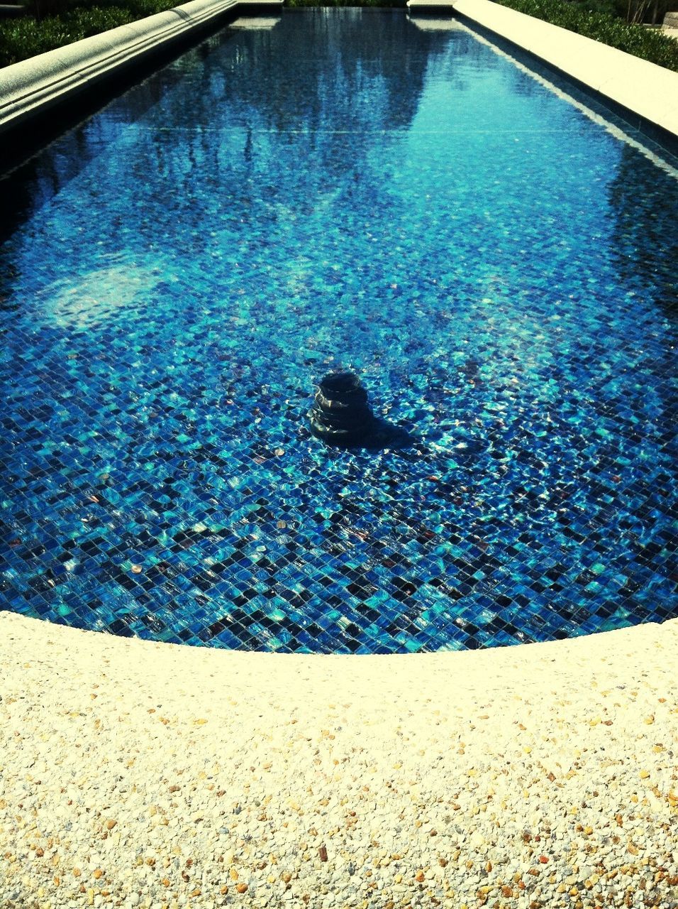 high angle view, blue, water, asphalt, swimming pool, reflection, transportation, day, no people, elevated view, road, street, outdoors, sunlight, nature, puddle, shadow, pattern, turquoise colored, directly above