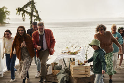 Family having lunch on pier