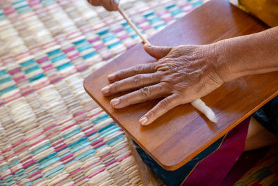 High angle view of hand holding paper