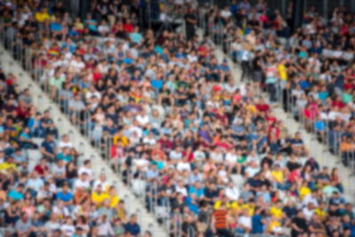 Group of people on field against blurred background