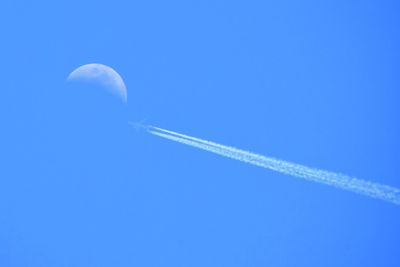 Vapor trails in blue sky