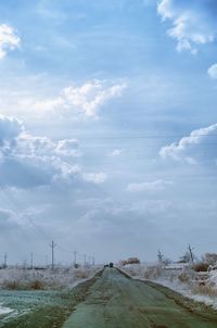 Empty road against sky