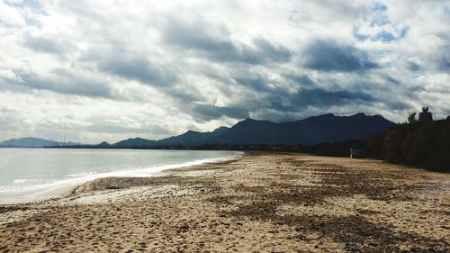 Scenic view of sea against cloudy sky