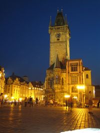 Illuminated buildings in city at night