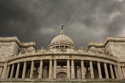 Low angle view of historical building against cloudy sky