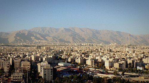 Aerial view of cityscape against clear sky