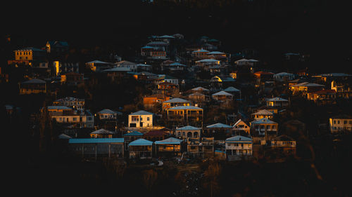 High angle view of illuminated buildings in city at night