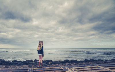 Woman standing on beach
