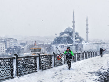 View of buildings in city during winter