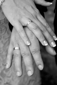 Midsection of couple holding hands