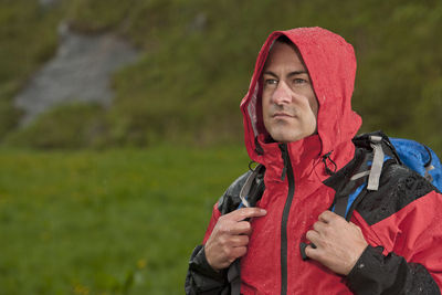 Man hiking in the rain in england