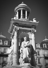 Low angle view of statue against sky at night